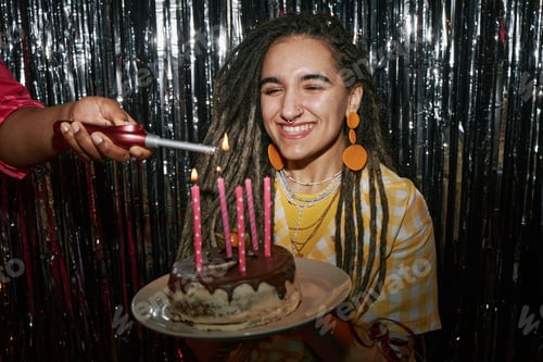 Preview: Portrait of Young Adult Caucasian Woman Smiling While Celebrating Birthday
