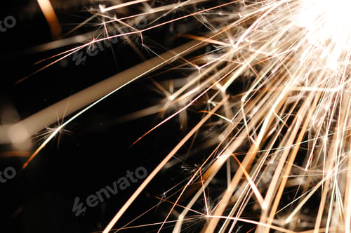 Preview: Close-up of golden sparkles of a burning fire