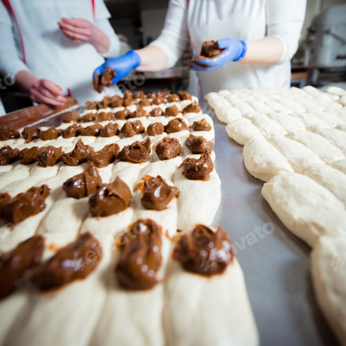 Preview: Bakers make buns from dough with filling of condensed milk