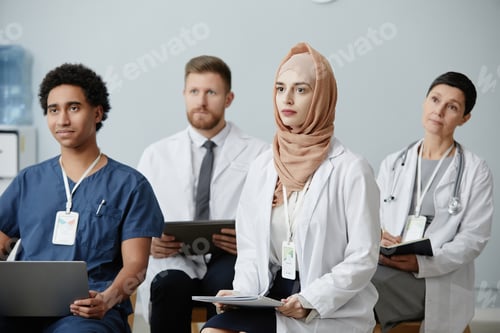 Preview: Doctors sitting in audience at educational seminar