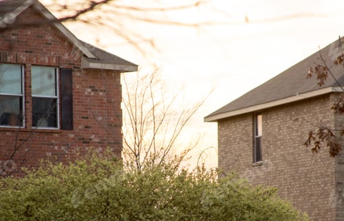 Preview: Rooflines in the neighborhood at sunset in the spring