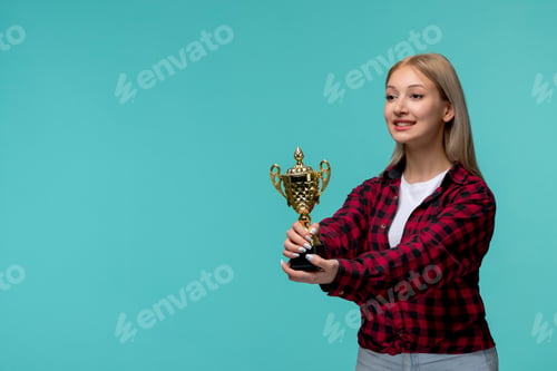 Preview: international students day cute young girl in red checked shirt smiling and giving a trophy