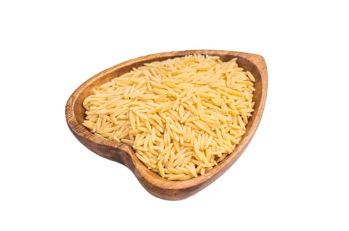Preview: Raw Orzo pasta, uncooked dry Italian risoni in a bowl isolated on white background. top view