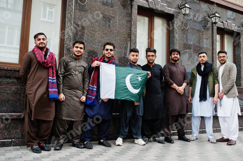 Preview: Group of pakistani man wearing traditional clothes salwar kameez or kurta with Pakistan flags.