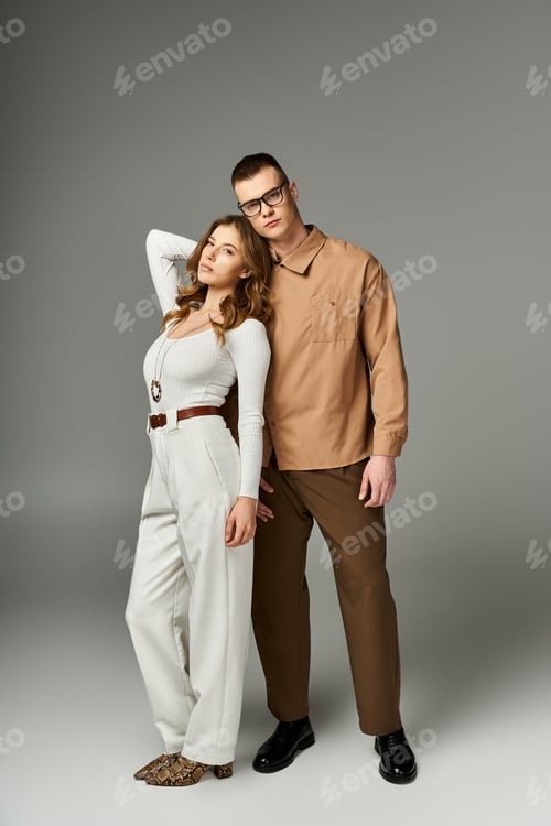 Preview: Elegant couple radiates romance in stylish attire during a memorable moment
