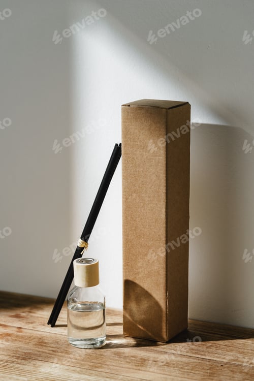 Preview: Elegant Reed Diffuser With Shadows on Wooden Surface in Soft Morning Light