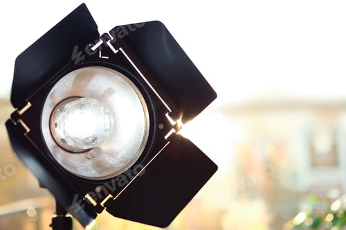 Preview: Professional photo studio lighting equipment on blurred background. Space for text
