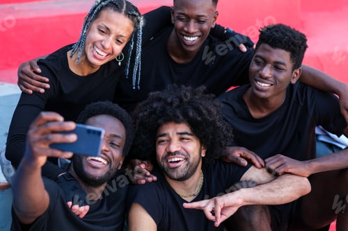 Preview: group selfie of young people with urban style in the city
