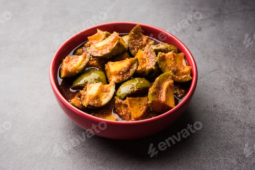 Preview: Indian Homemade Raw Mango Pickle or aam ka achar or Kairi Loncha in a bowl