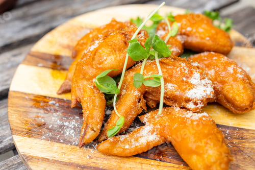Preview: Grill fry chicken wings over wooden board