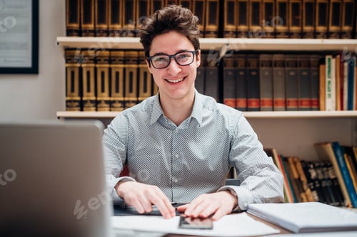 Preview: Young caucasian professional businessman indoor looking camera smiling