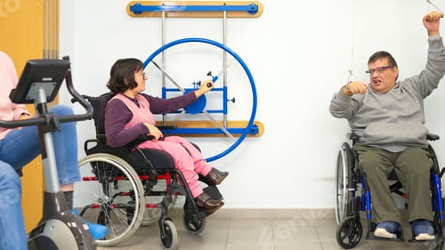 Preview: People in wheelchairs doing rehabilitation exercises in a clinic