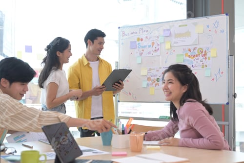Preview: Group of creative people brainstorm over business project together.