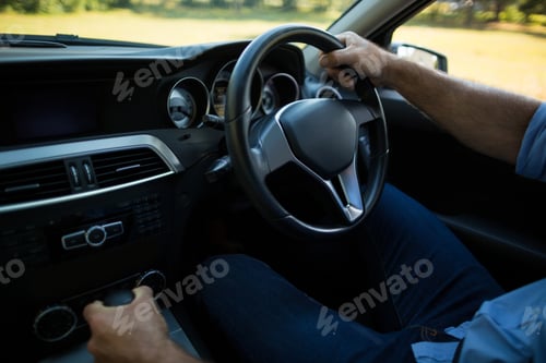 Preview: Close up of man driving car