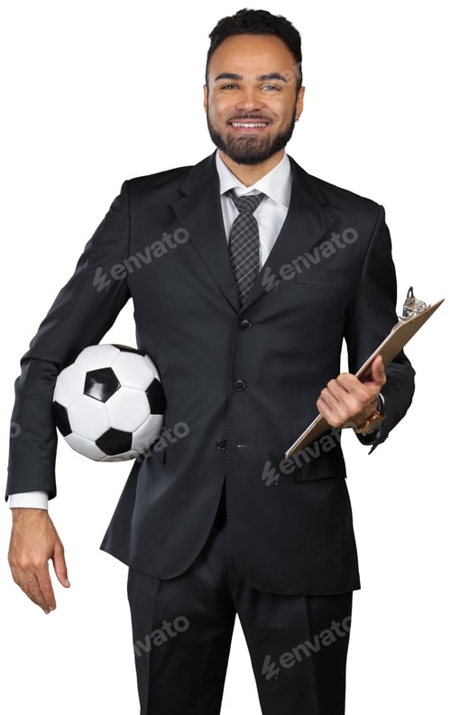 Preview: Soccer coach holding a ball and a clipboard in a formal suit indoors