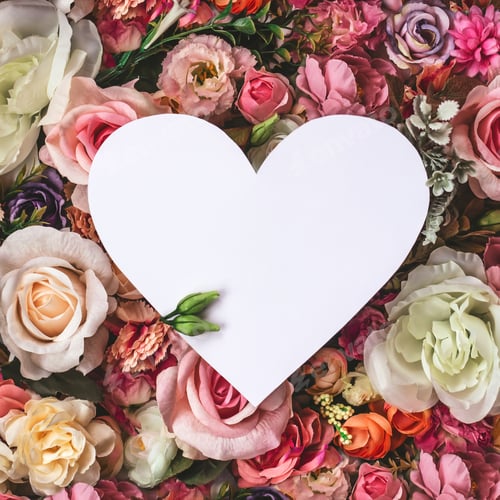 Preview: Beautiful colorful flowers wall background, with white heart greeting card with copy space; Spring,