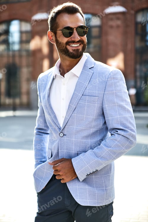 Preview: Portrait of handsome man in suit posing in the street