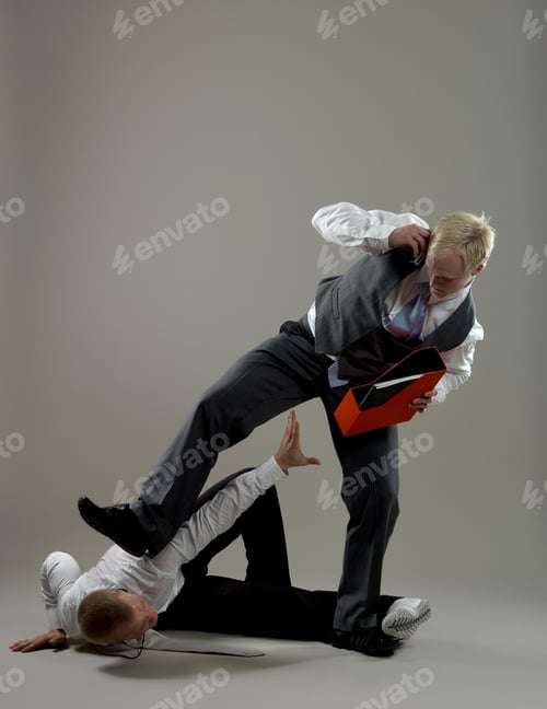 Preview: Business man fighting over paper holder