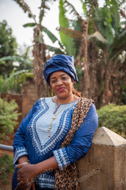 Preview: Portrait of a smiling mature African woman dressed in traditional African clothing.