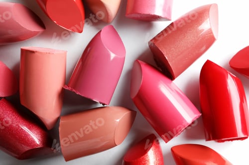Preview: Collection of lipsticks on white background, top view