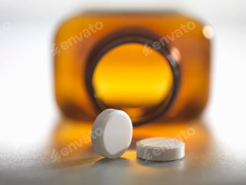 Preview: Pain killers pouring from brown medicine bottle