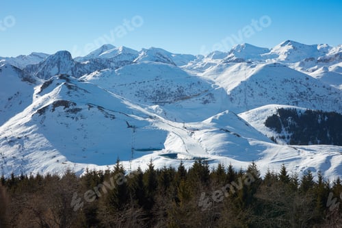 Preview: Alps mountains with snow in winter, blue sky in a sunny day