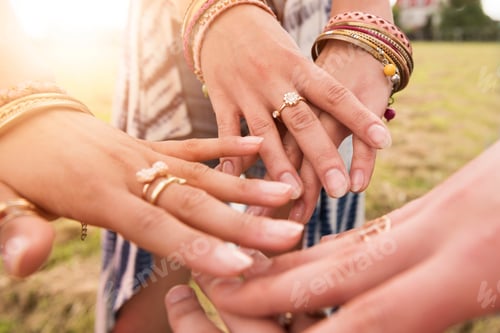 Preview: Hands decorated with colorful jewelery