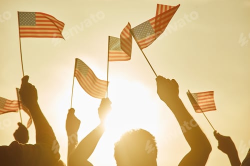 Preview: People hold american flags.