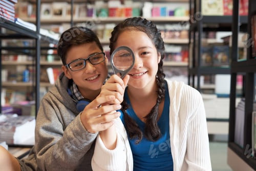 Preview: Teenagers with magnifier sitting together and smiling