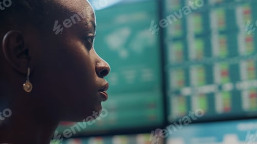 Preview: Hedge fund trader analyzing real time stocks on monitors