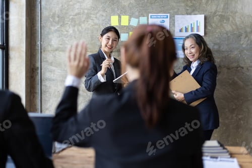 Preview: Business meeting. Senior managers talk to employees in the conference room.