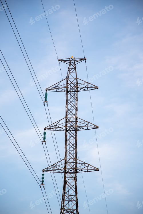 Preview: Vertical shot of a transmission tower against the background of blue sky.