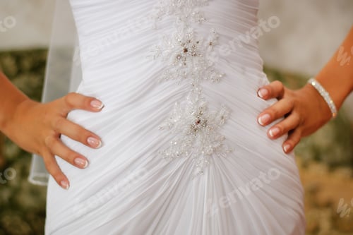 Preview: Bride Holding Hands on White Wedding Dress