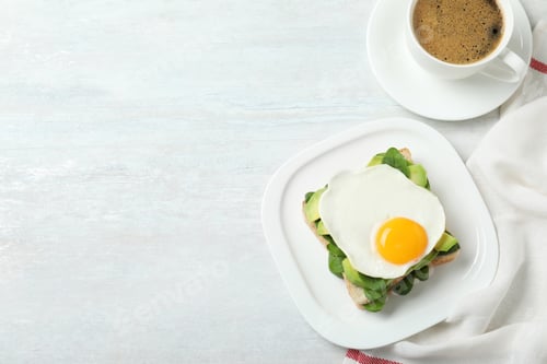 Preview: Delicious breakfast with fried egg served on table, flat lay. Space for text