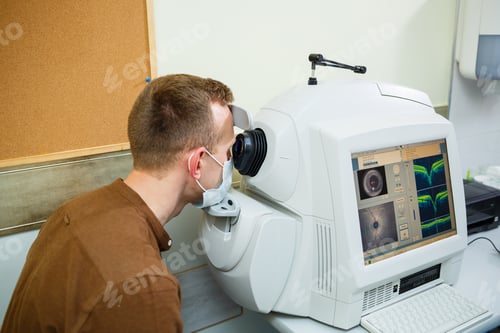 Preview: Professional medical equipment scanning the patient's eyes. The device of a modern healthcare clinic