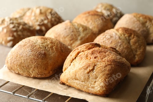 Preview: Cooling rack with fresh baked buns on gray background