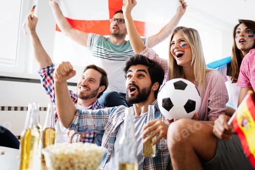 Preview: Group of friends having fun at home, watching game and enjoying together