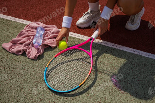 Preview: Close-Up of Female Tennis Player Preparing on Outdoor Court with Racket, Ball
