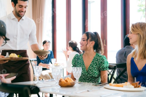 Preview: Waitress man serving food to group of diverse customer in restaurant, eatery client woman