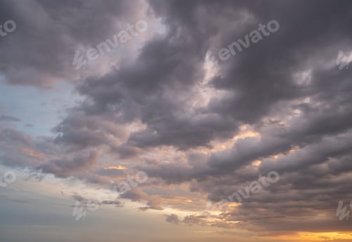 Preview: Sunset sky. Abstract nature background. Dramatic blue and orange, colorful clouds at twilight time.