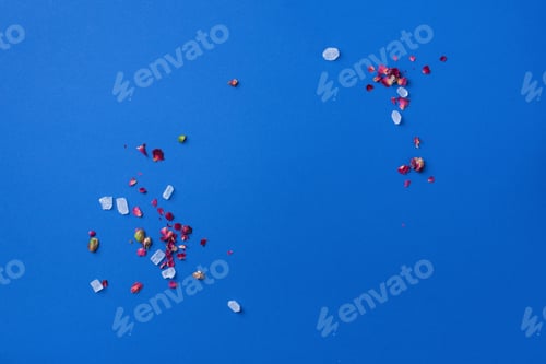 Preview: Middle Eastern sweets. Turkish delight with pistachios nuts on plate over blue background. Top view