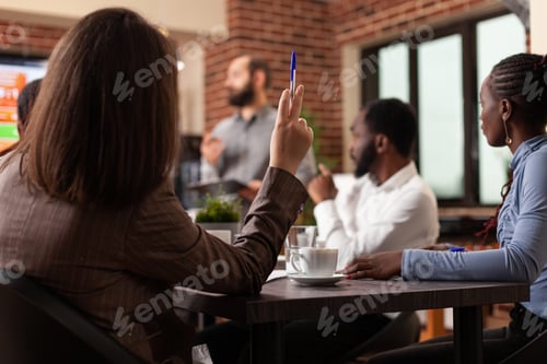 Preview: Diverse businesspeople working at management presentation
