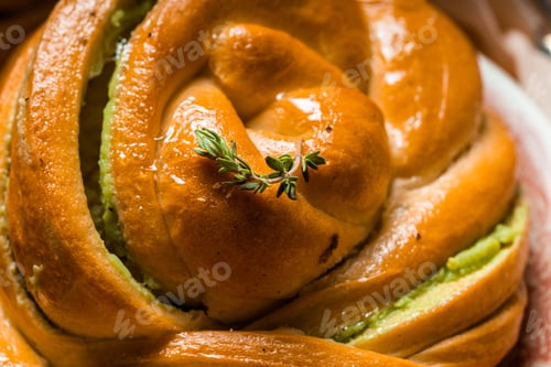 Preview: homemade buns with cream and pistachio cream decorated with thyme freshly baked for breakfast