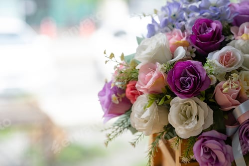 Preview: Beautiful bouquet of colorful rose petals in a vase. women's day or wedding background with copy spa