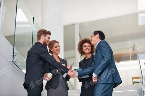 Preview: Cropped shot of businesspeople shaking hands in a modern office