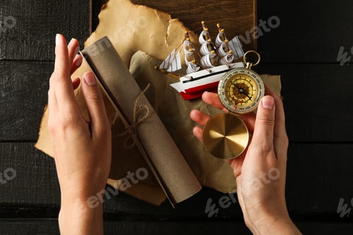 Preview: Columbus Day. A paper scroll with a compass and a ship