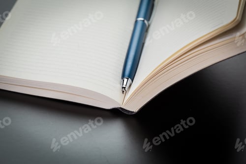 Preview: blank notebook and pen on the table