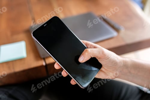 Preview: Closeup of a businessman using a mobile phone