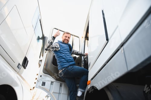 Preview: Truck driver climbing into cab of semi truck