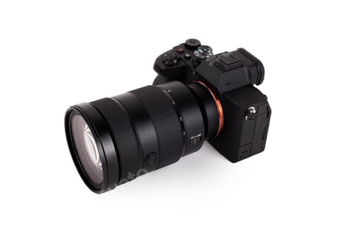 Preview: Modern Camera Lens and Body on White Backdrop